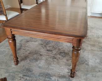 Dining room table is 76" long and includes two 18" leaves (one shown)