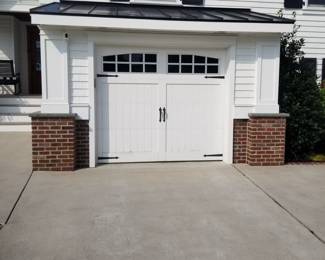 Very handsome carriage house style garage door is 8 ft. Wide x 7 ft. Tall