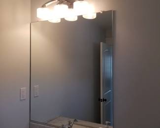 Mirror; vanity light