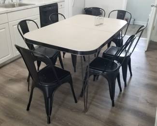 Retro style kitchen table seats 6; extra chairs available