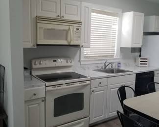Clean & classic white kitchen with granite countertops