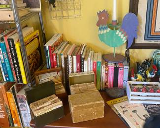 Cook books and boxes of handwritten recipes.