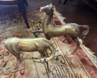 Pair of brass horses, one missing a tail