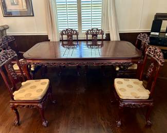 Chinese dining table and 6 chairs. There is a leaf in the table in this picture.