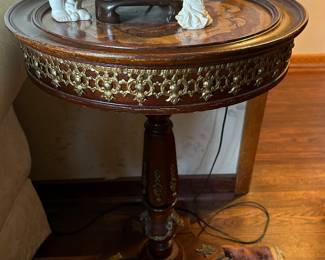 Pair of round pedestal tables with inlaid tops and brass embellishments