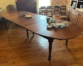 Dining table with center legs. Drop sides, 30”-130”