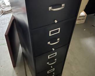 Vertical file cabinet with lock