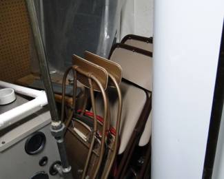 Folding chairs, stacked neatly, until we can set them up