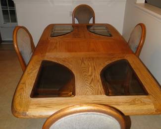 Solid wood 1980's table with matching chairs, get those vintage recipes out this holiday season and sit around this perfect table, right out of the 80's