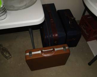 Suitcases, and a very nice, in fantastic shape, briefcase