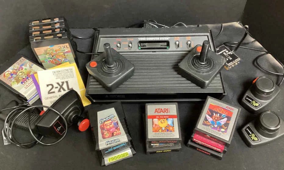  01 ATARI 2600 with Joy Sticks, Space Age, Paddles. Games Included. 2XL 8 Track Tapes