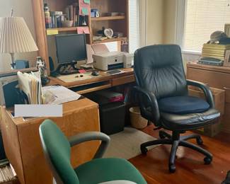 Two office chairs wooden desks with hutch