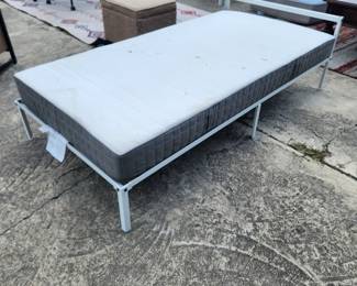 Twin bed with used but comfortable matress.