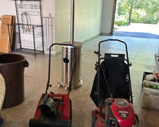 All seasons outdoor tools Lawn Mower Snow Blower and an outdoor heater