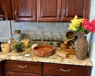 Four handled pottery serving dish, round glass jar with rope handle, rectangular birch box with seven clear apothecary jars, bamboo boxes, kitchen accessories and decor.