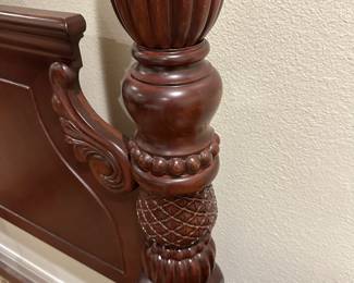 Stately king-size poster bed. Arched scroll headboard and footboard, fluted columns, cherry finish. A really grand look!