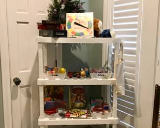 Games and toys! Twister, Scrabble, Scrabble Junior, Pictionary.  Toys, Cars, Peanuts figurines, trinkets and play jewelry, art kits, puzzles, Barbie DVDs, and more.