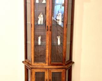 Vintage lighted wooden display cabinet. Glass shelves, doors, and side panels. A charming fit anywhere.