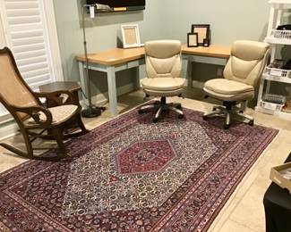 Office outfitted with matching tables and matching Serta leather chairs.