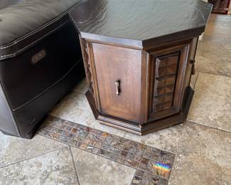 Mid Mahogany hexagon table with slate top. These are great tables! The slate top is practically indestructible and there’s tons of concealed storage. Truly useful and they will last at least another 60 years.  There are two of these tables.