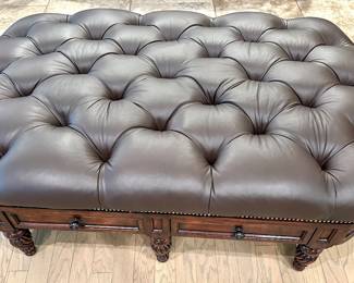 Chesterfield style leather ottoman/cocktail table. Two drawers on either side, nail head trim, turned wood feet.