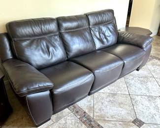 Kincord leather power reclining sofa. Left and right reclining seats – stationary center seat.  Wall hugger! Place it as close to the wall as you want. A stylish piece of pure, delightful comfort!