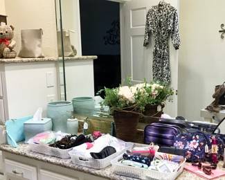 Ladies vanity boxes and bags, trinkets and pouches, sunglasses, mirrors and perfumes.