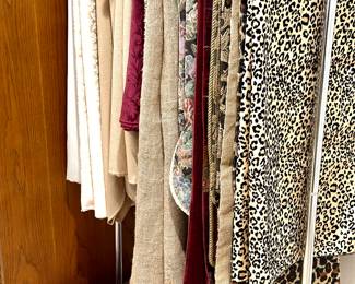 A lovely collection of runners and round, square, and oblong tablecloths. Materials include leopard prints, brocades, velvets, Burlap, linen, basket wave, and damask.