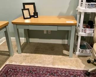 Office desk/work table. Solid wood frame painted slate gray, oak veneer top with rounded corners, center drawer, excellent “like new” condition. There are two desks. 