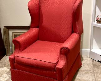 Beautifully upholstered wing back chair, lovely condition. Arm covers beneath the seat. Beneath the skirting is a solid mahogany frame with stretcher. Remove the skirt to change this into a more contemporary Chippendale style chair.