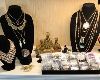 A wide and fabulous assortment of costume jewelry. Bracelets, necklaces, rings, In gold and silver tone, Rhinestone, beaded, hammered, pearl, brass, and in every color of the rainbow