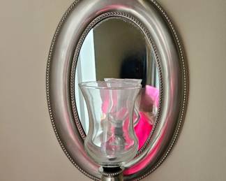 One of a pair of brushed metal candle sconces