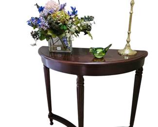 Demilune three legged table