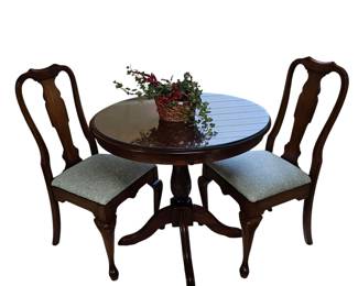 Cherry pedestal table with protective glass and two Queen Anne chairs