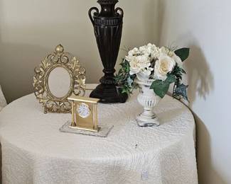 Sturdy round table with off white floor length covering