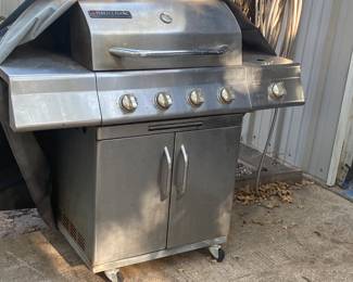 Grill with butane tank and cover.