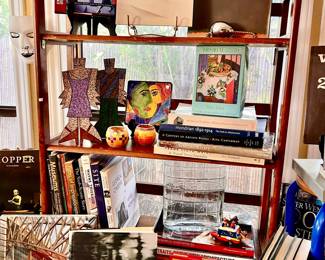 ROOM FULL OF MUSEUM ART BOOKS AND CARDS.