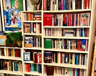 SO MANY BOOKCASES FULL ALL THROUGHOUT THE HOUSE.