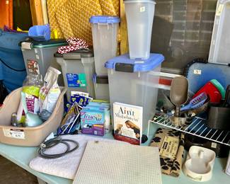 Lots of cat and dog supplies, bedding, leashes, bowls.