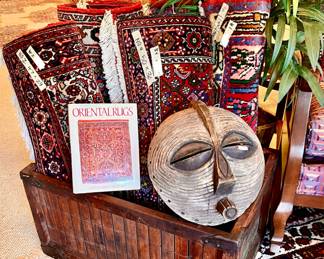 LUBA AFRICAN MASK, WOODEN CRATE FULL OF FANTASTIC PERSIAN RUGS.