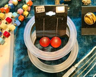 ALEXIS BITTAR BANGLES AND EARRINGS.