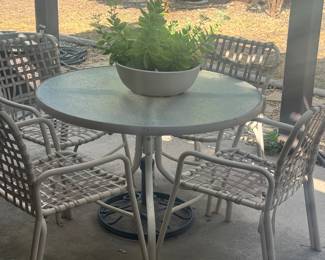 outdoor patio furniture, table and 4 chairs, potted plants