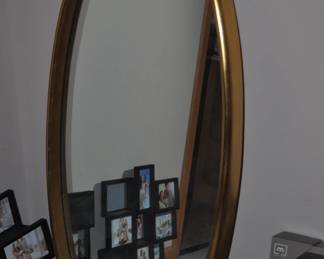 Oval mirror with gold frame