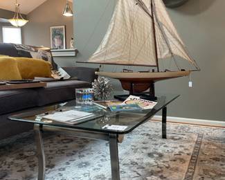 Mikasa Slovenia Cube, Urban Trends metal ribbon art ball, glass coffee table, Gertmenian Brio Malene gray rug