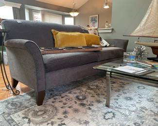 England Inc. Couch, Mikasa Slovenia Cube, Urban Trends metal ribbon art ball, accent pillows, glass coffee table, Gertmenian Brio Malene gray rug