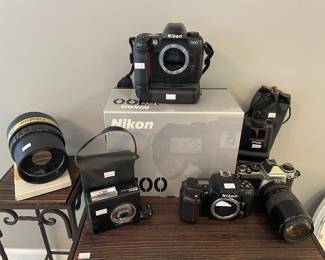 Nikon N6006,  Nikon Speedlight SB-25,  Nikon EN-EL3 Battery,  Nikon D100 with battery, Nikon SB-15
Nikon Nikkor 24mm f/2.8 lens

