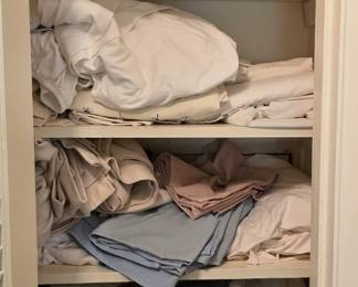 This closet we haven't worked on it. Lots of Sheet sets and blankets