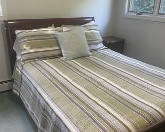 Queen bed with mattress and bed linens