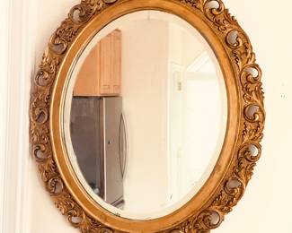Old oval gilt mirror with beveled edge (22” x 26”)
