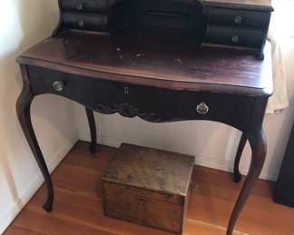 Antique mahogany writing desk with glass drawer pulls (34”L, 19”D, 36.5” tall at back. Writing surface is 30”H)